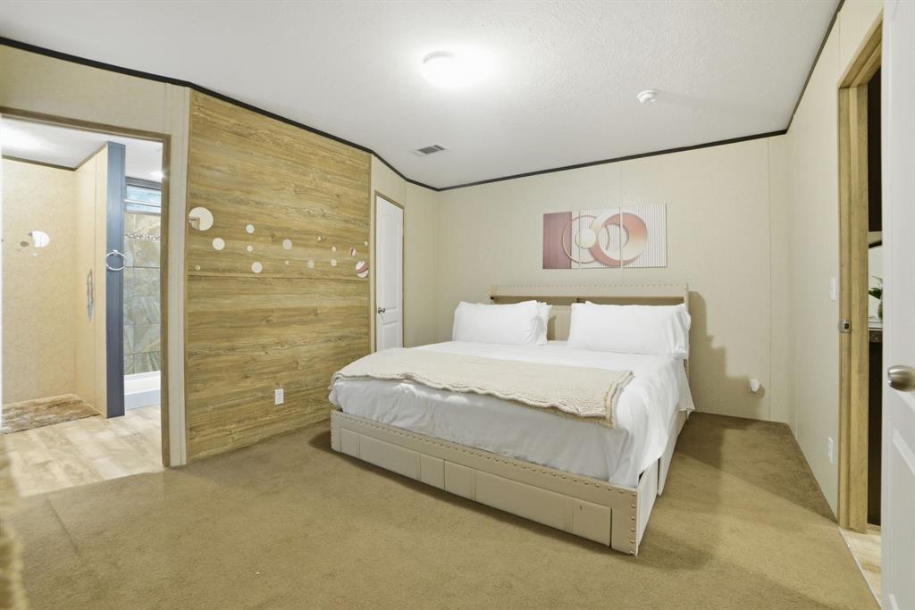127 Almond Road Minden, LA 71055 - Photo 12 of 25 a bedroom with a bed and a painting on the wall