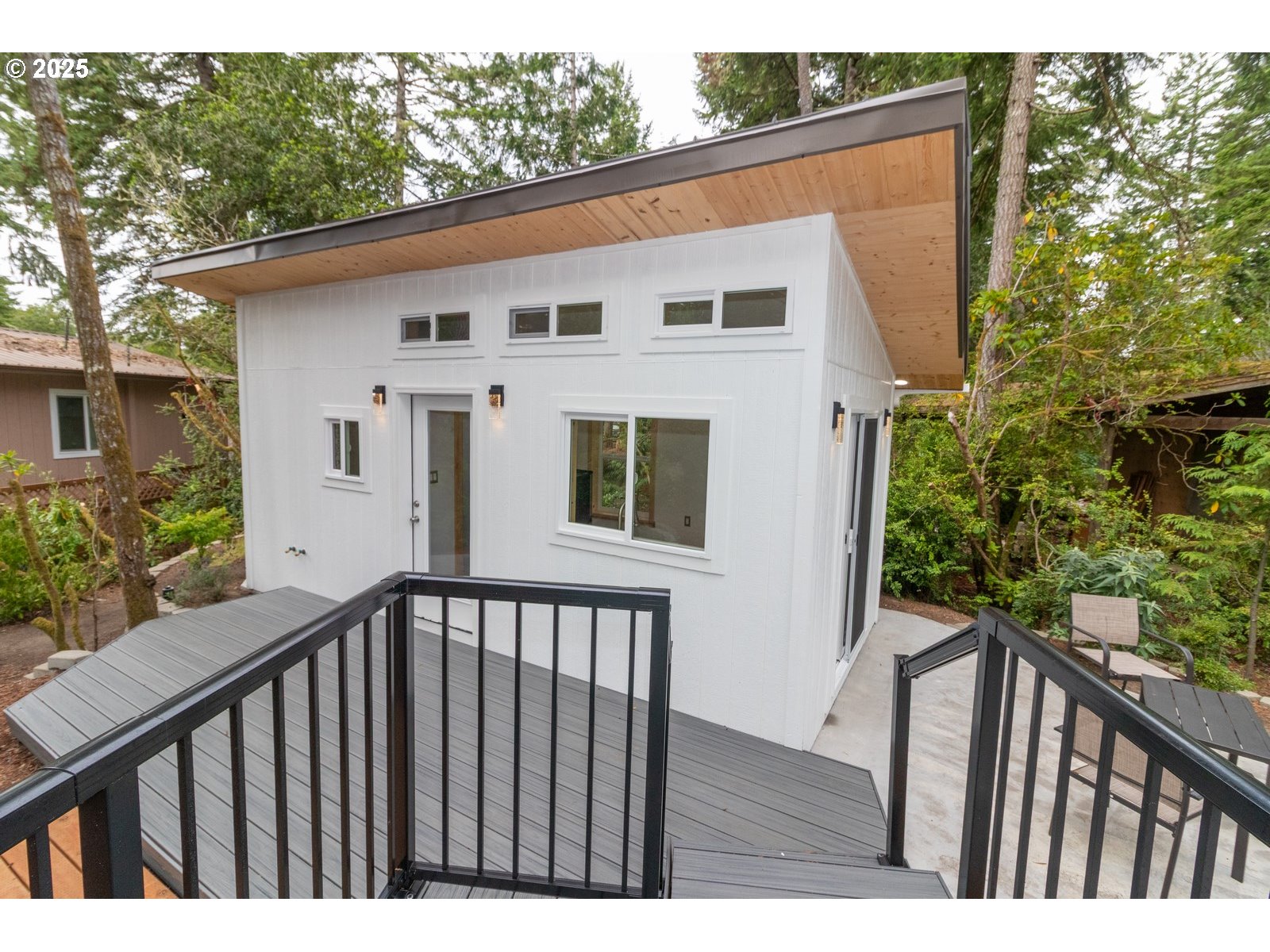 231 Horseshoe Bend Florence, OR 97439 - Photo 17 of 26 a view of a house with backyard and deck