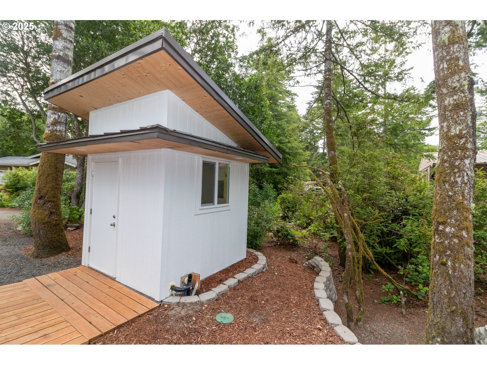231 Horseshoe Bend Florence, OR 97439 - Photo 21 of 26 a view of a house with a yard