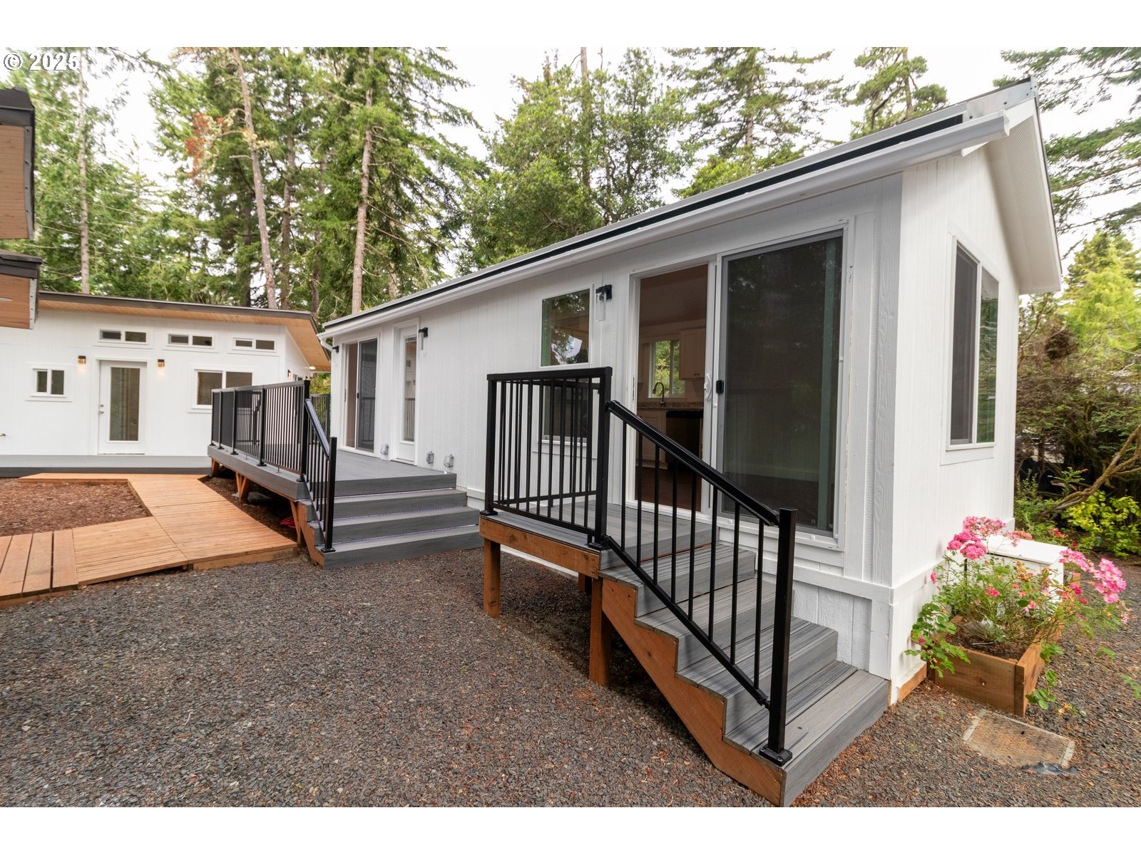231 Horseshoe Bend Florence, OR 97439 - Photo 3 of 26 a view of a house with backyard and furniture