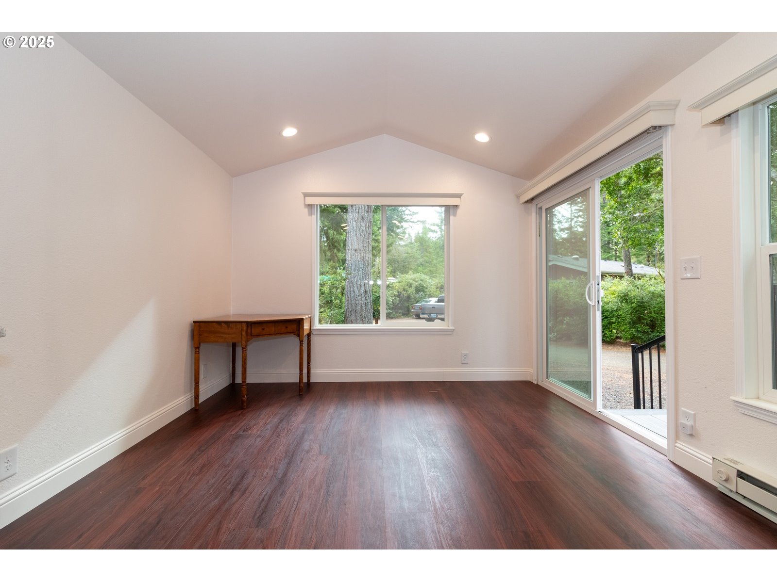231 Horseshoe Bend Florence, OR 97439 - Photo 6 of 26 a view of room with hardwood floor and windows