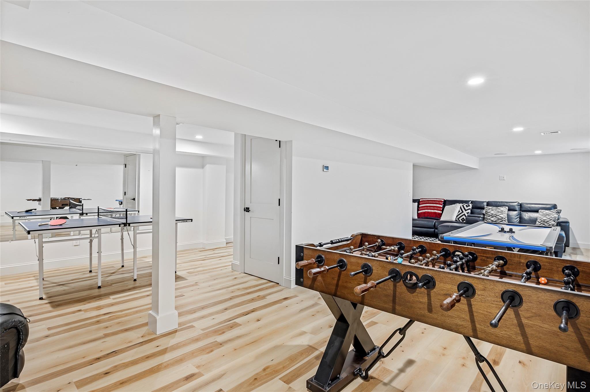 9 Jennifers Path Quiogue, NY 11978 - Photo 23 of 29 Game room featuring recessed lighting, baseboards, and light wood-style flooring