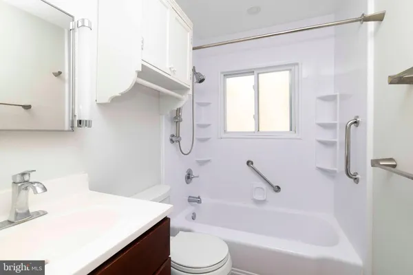 a bathroom with a sink a toilet and a bathtub