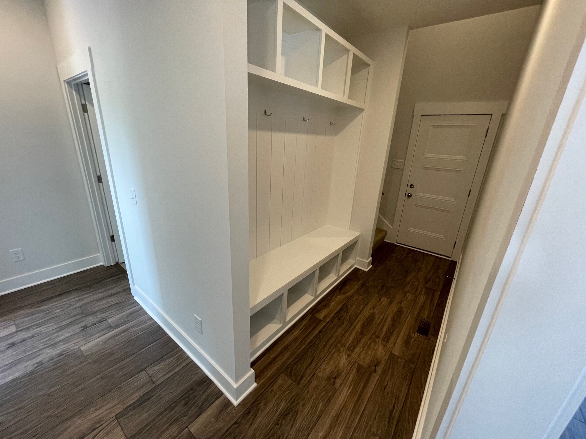 93 Hoodoo Road Beechgrove, TN 37018 - Photo 4 of 4 a view of a hallway with wooden floor and staircase