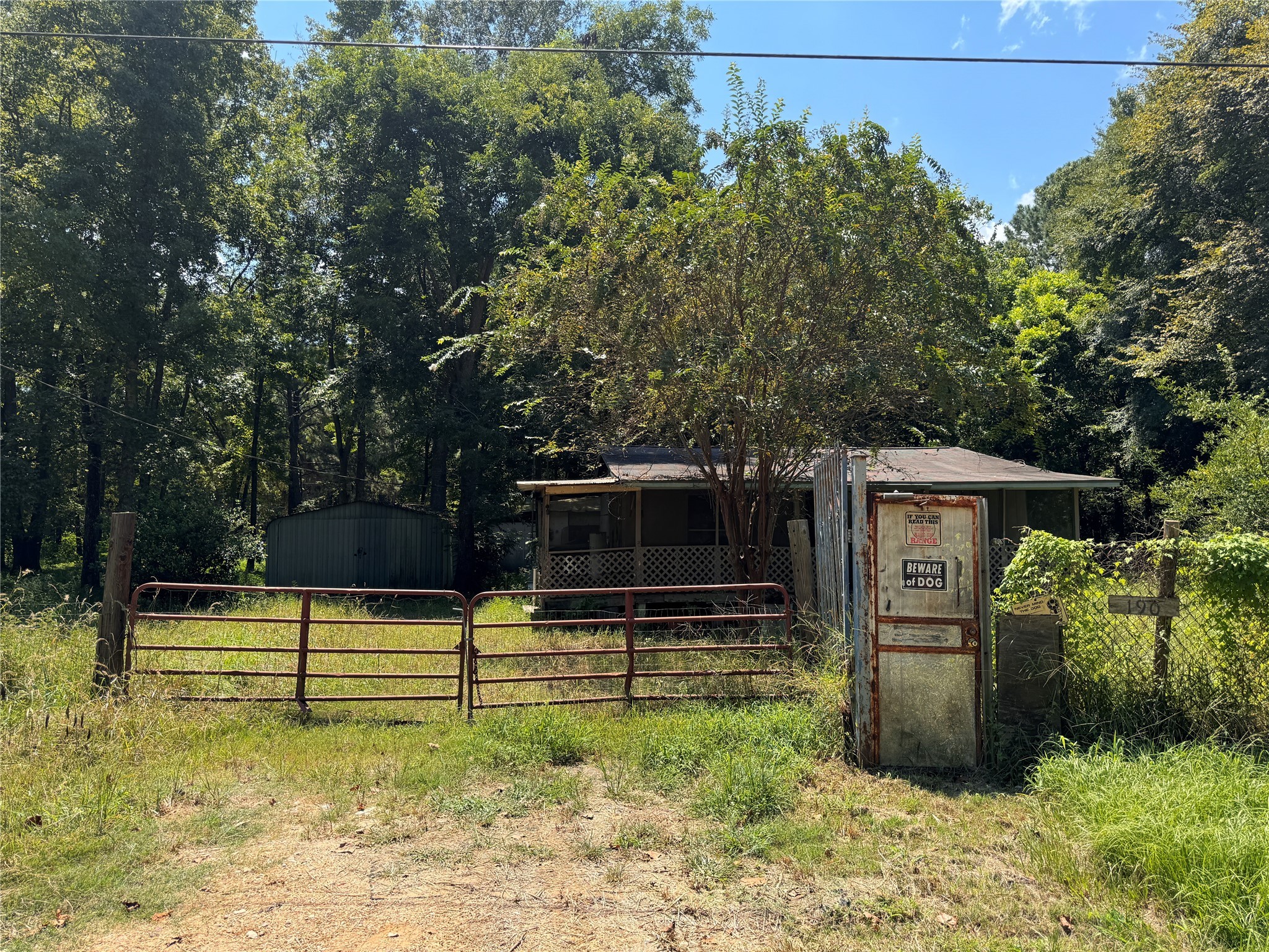 190 Mudd Street Coldspring, TX 77331 - Photo 5 of 6 a view of backyard with wooden fence