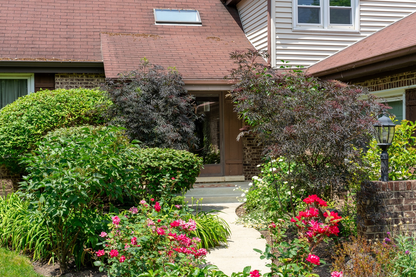 958 Suffield Terrace Northbrook, IL 60062 - Photo 2 of 39 a front view of house and yard with flower pots