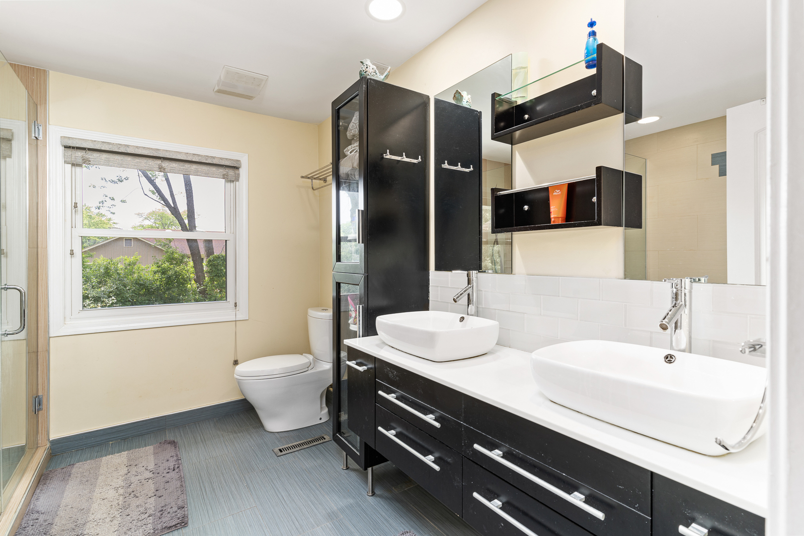 958 Suffield Terrace Northbrook, IL 60062 - Photo 32 of 39 a bathroom with a double vanity sink a mirror and a shower