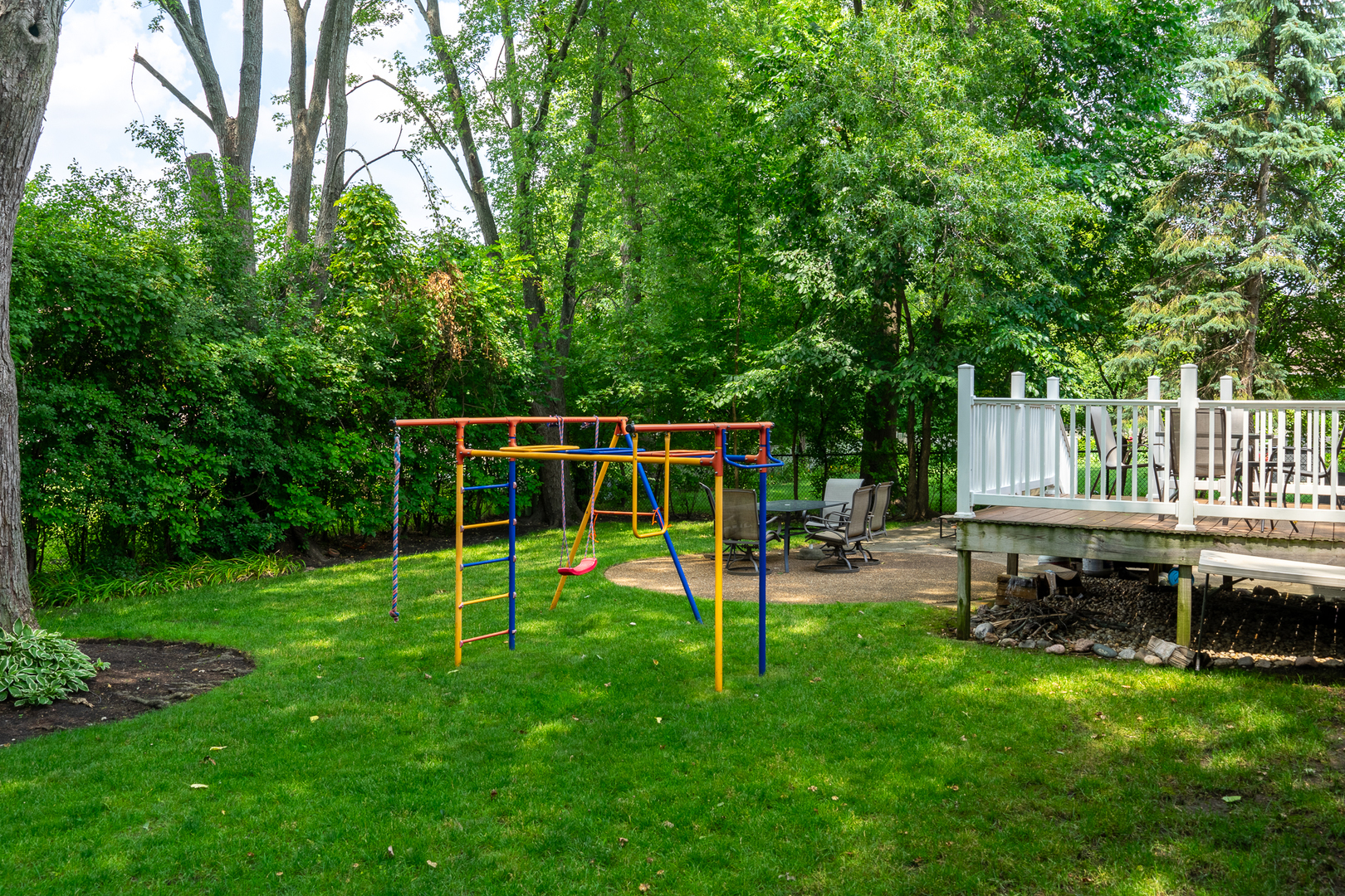 958 Suffield Terrace Northbrook, IL 60062 - Photo 36 of 39 a view of a backyard with a slide trees and wooden fence