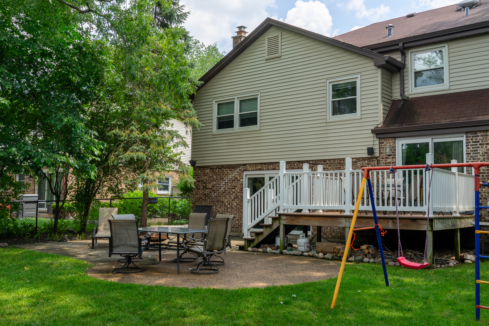 958 Suffield Terrace Northbrook, IL 60062 - Photo 37 of 39 a view of a chair and table in backyard of the house
