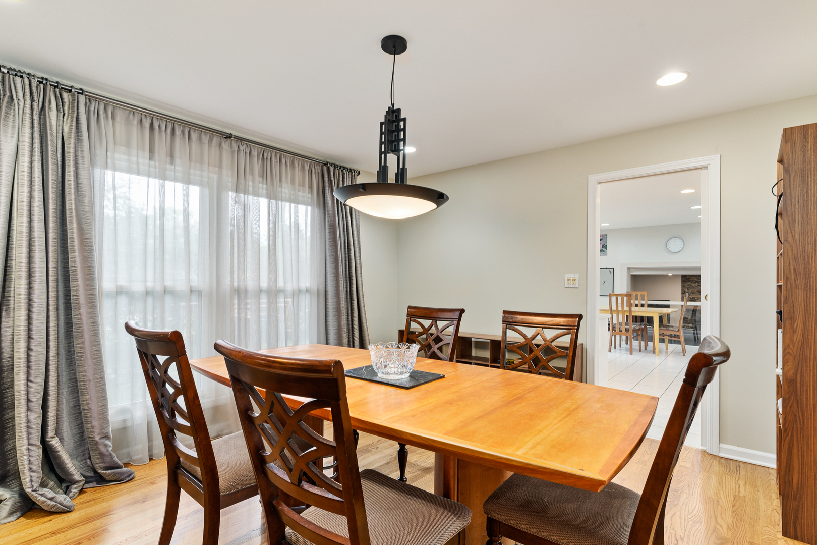 958 Suffield Terrace Northbrook, IL 60062 - Photo 7 of 39 a view of a dining room with furniture window and wooden floor