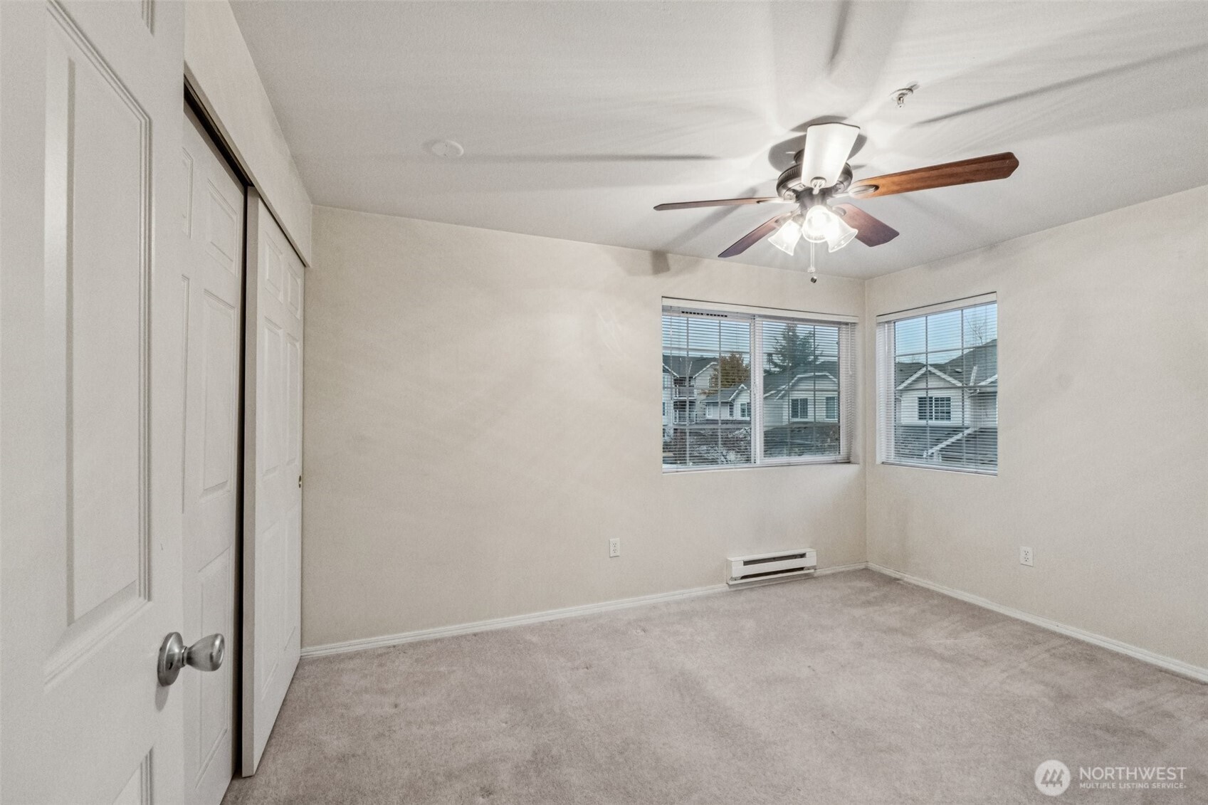 12505 4th Avenue West, Unit 2040 Everett, WA 98204 - Photo 12 of 22 an empty room with windows and fan