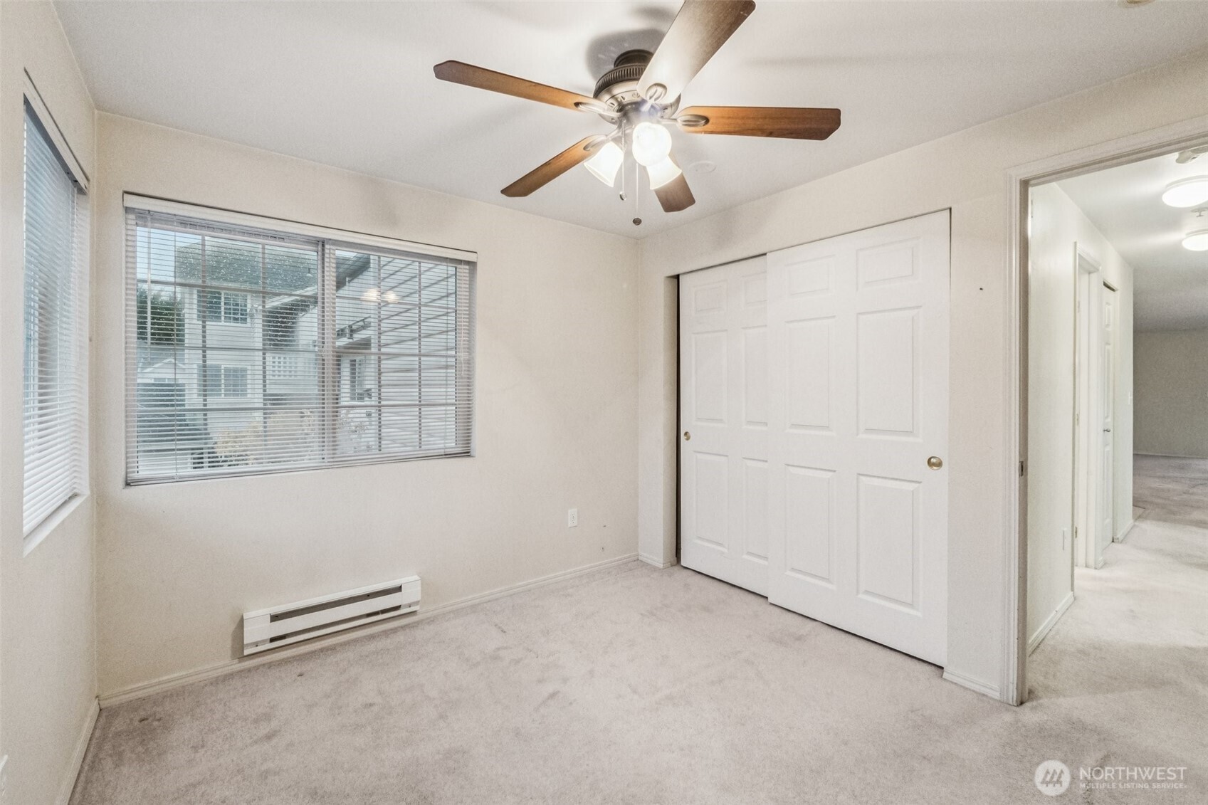 12505 4th Avenue West, Unit 2040 Everett, WA 98204 - Photo 15 of 22 an empty room with windows and fan