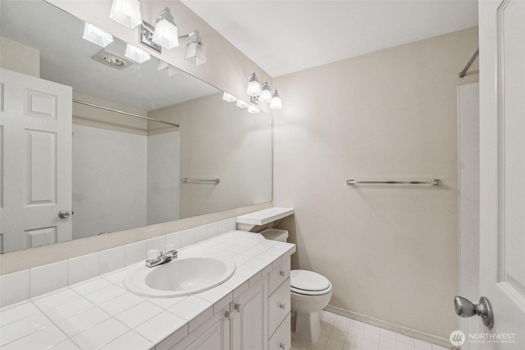 12505 4th Avenue West, Unit 2040 Everett, WA 98204 - Photo 16 of 22 a bathroom with a sink vanity granite and toilet
