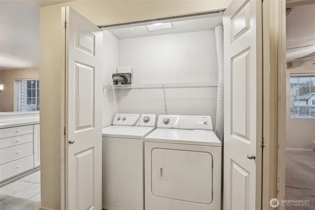 a utility room with dryer and washer