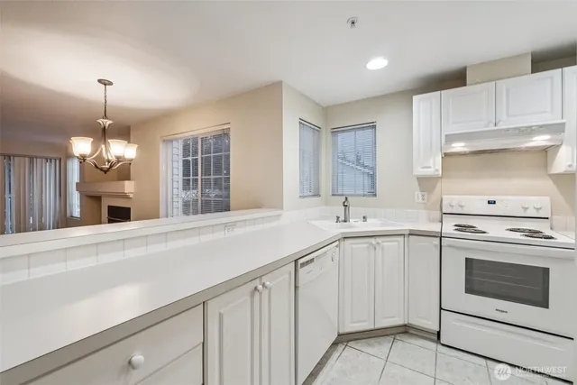 a kitchen with a sink and stove