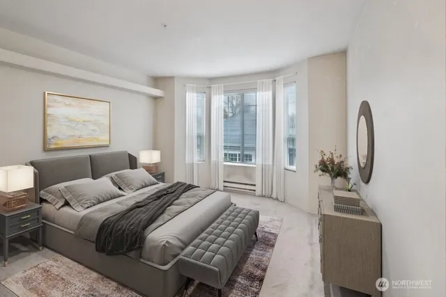 a bedroom with furniture and a window