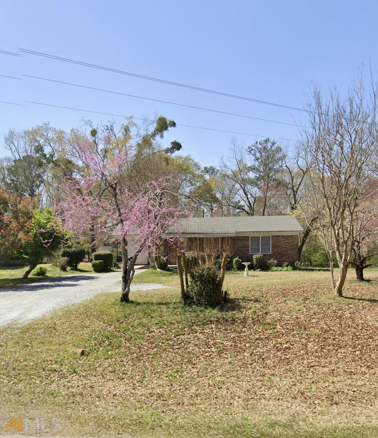 1330 Cox Road Madison, GA 30650 - Photo 1 of 1 a front view of a house with a yard