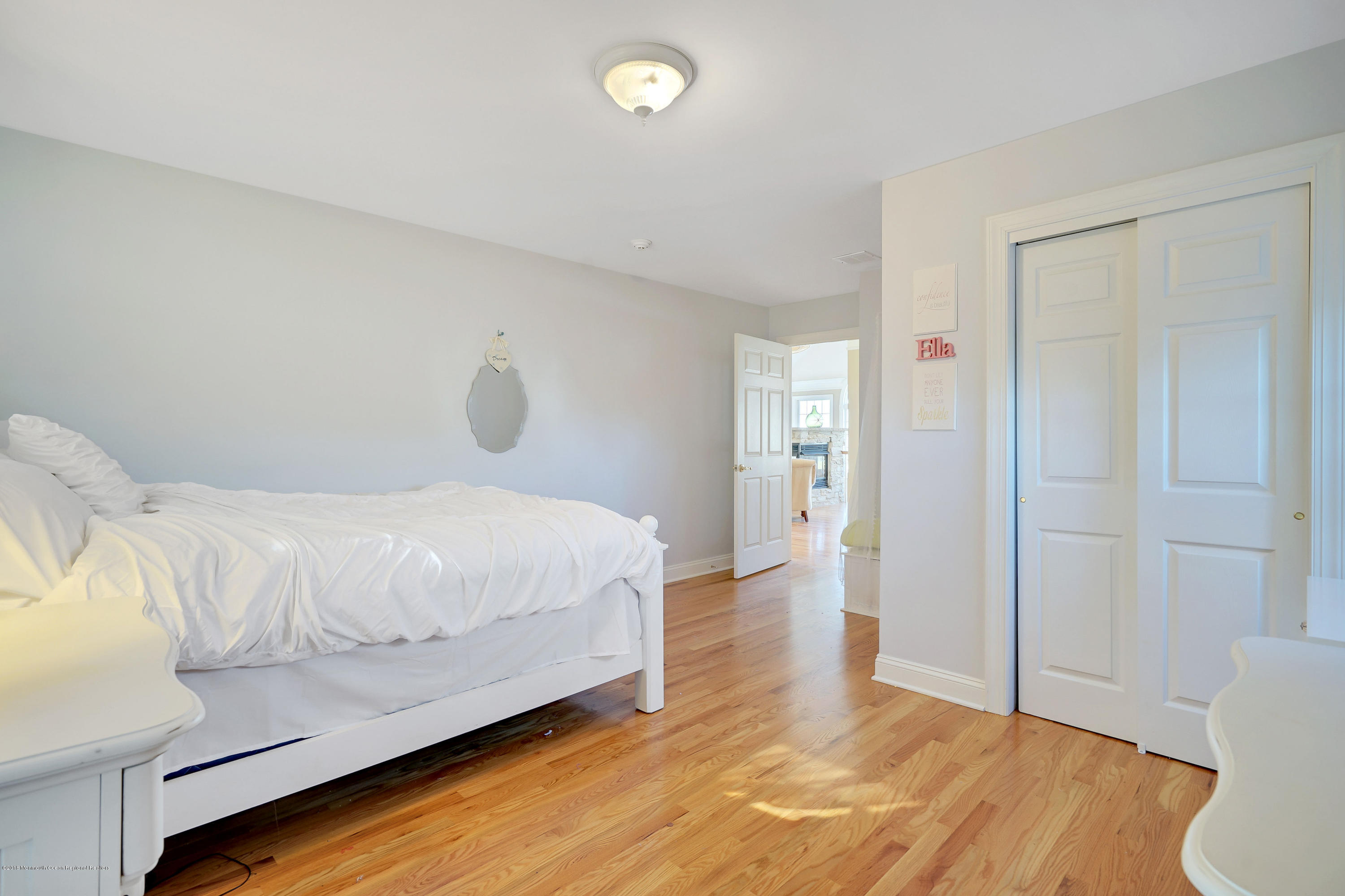 3305A River Road, Unit B Point Pleasant, NJ 08742 - Photo 29 of 56 a bedroom with a bed and wooden floor