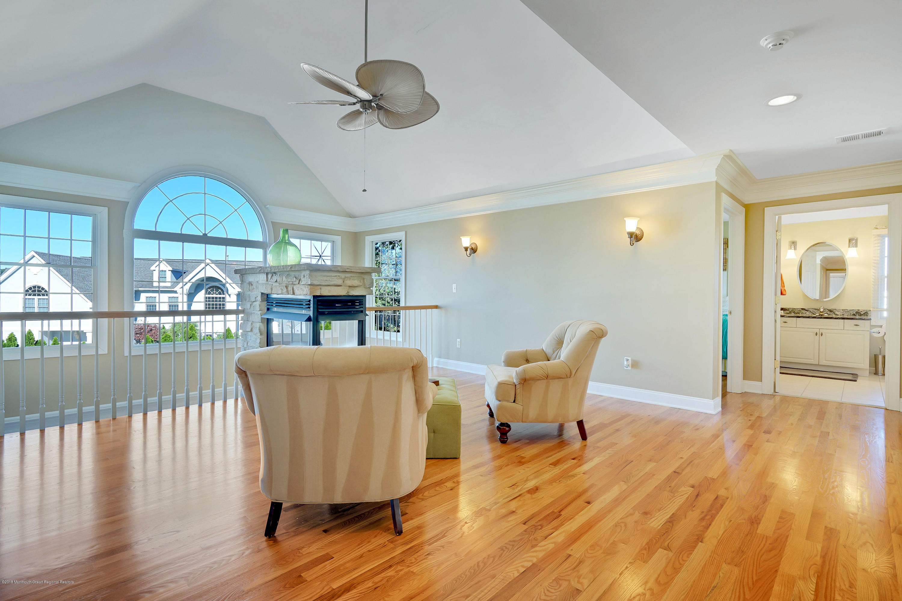 3305A River Road, Unit B Point Pleasant, NJ 08742 - Photo 36 of 56 a living room with furniture a fireplace and a floor to ceiling window