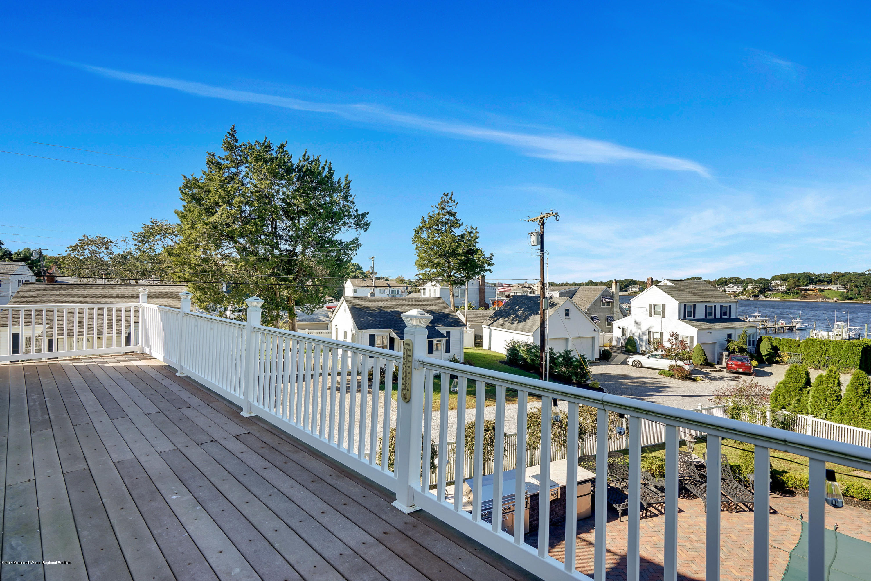 3305A River Road, Unit B Point Pleasant, NJ 08742 - Photo 49 of 56 a view of a balcony with wooden fence and floor