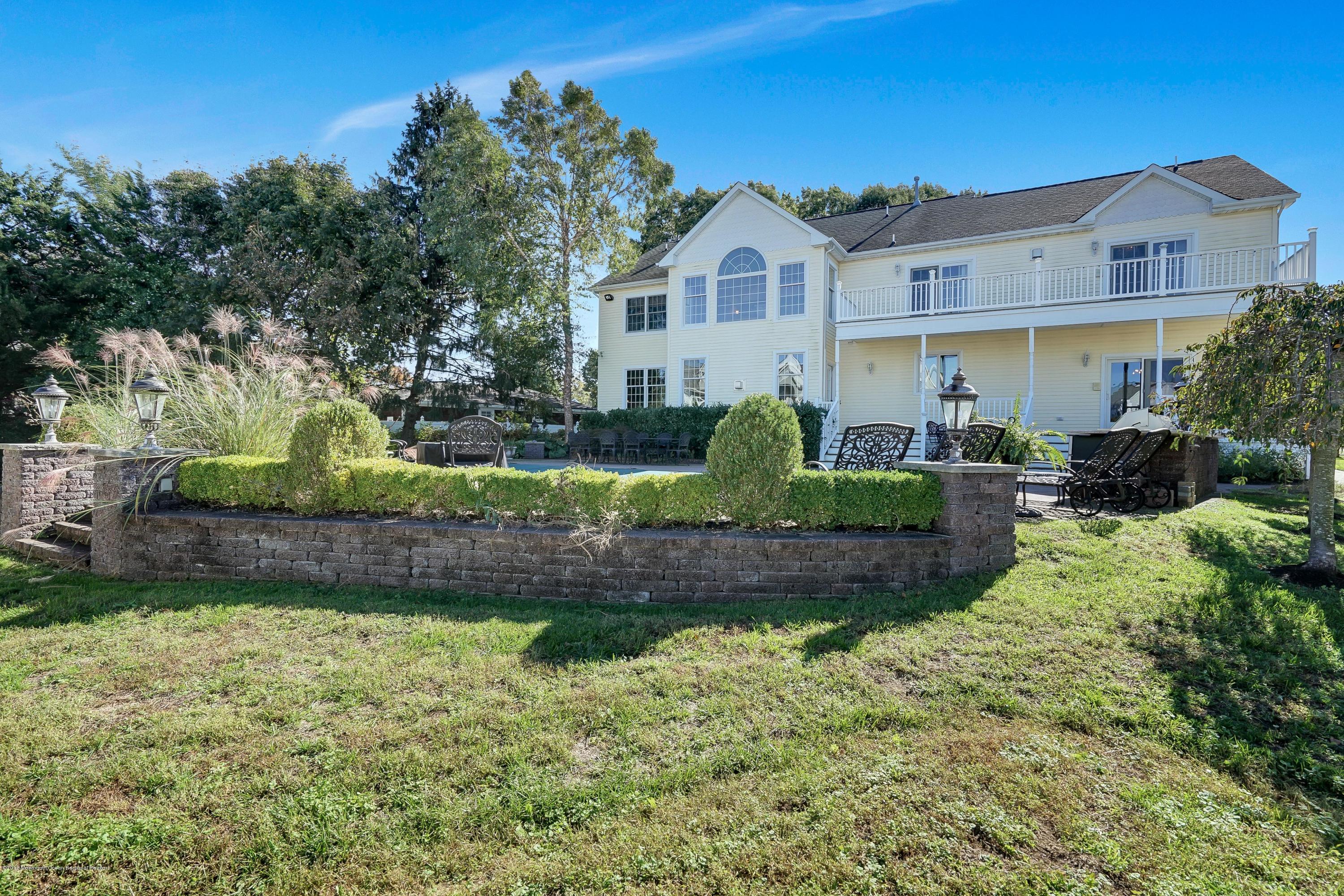 3305A River Road, Unit B Point Pleasant, NJ 08742 - Photo 54 of 56 a front view of a house with a yard