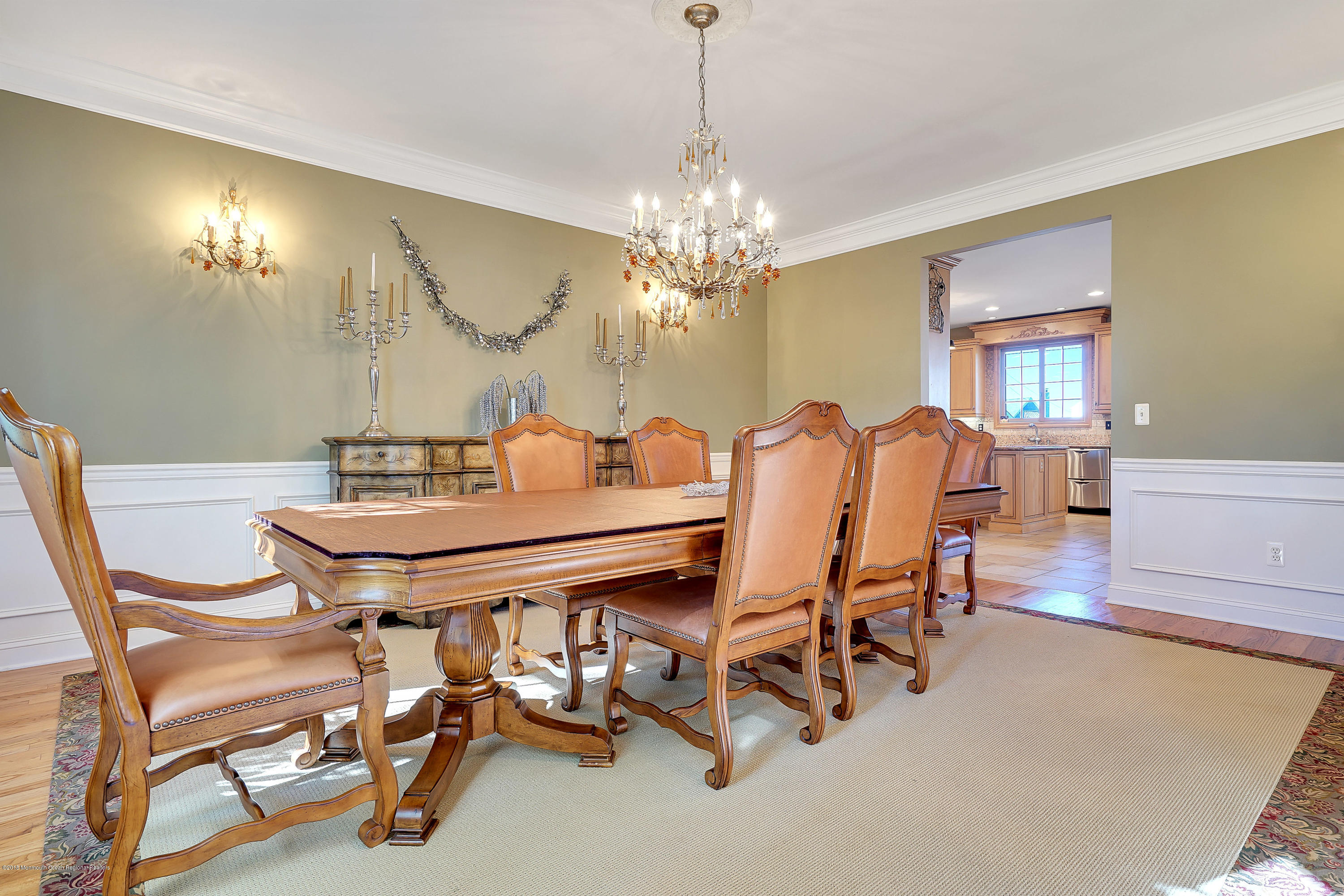 3305A River Road, Unit B Point Pleasant, NJ 08742 - Photo 10 of 56 a view of a dining room with furniture and chandelier
