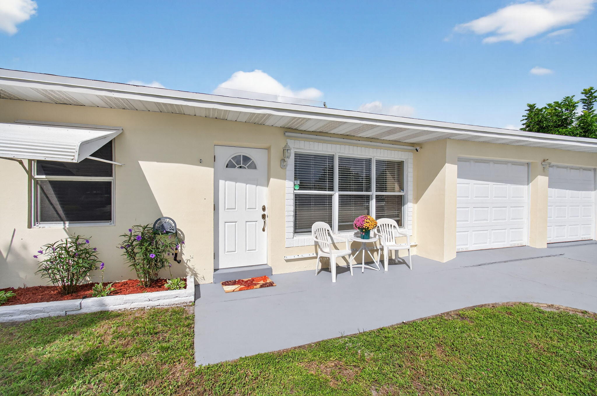 2841 Northeast 8th Terrace Pompano Beach, FL 33064 - Photo 16 of 65 a view of a chair and table in back yard of the house