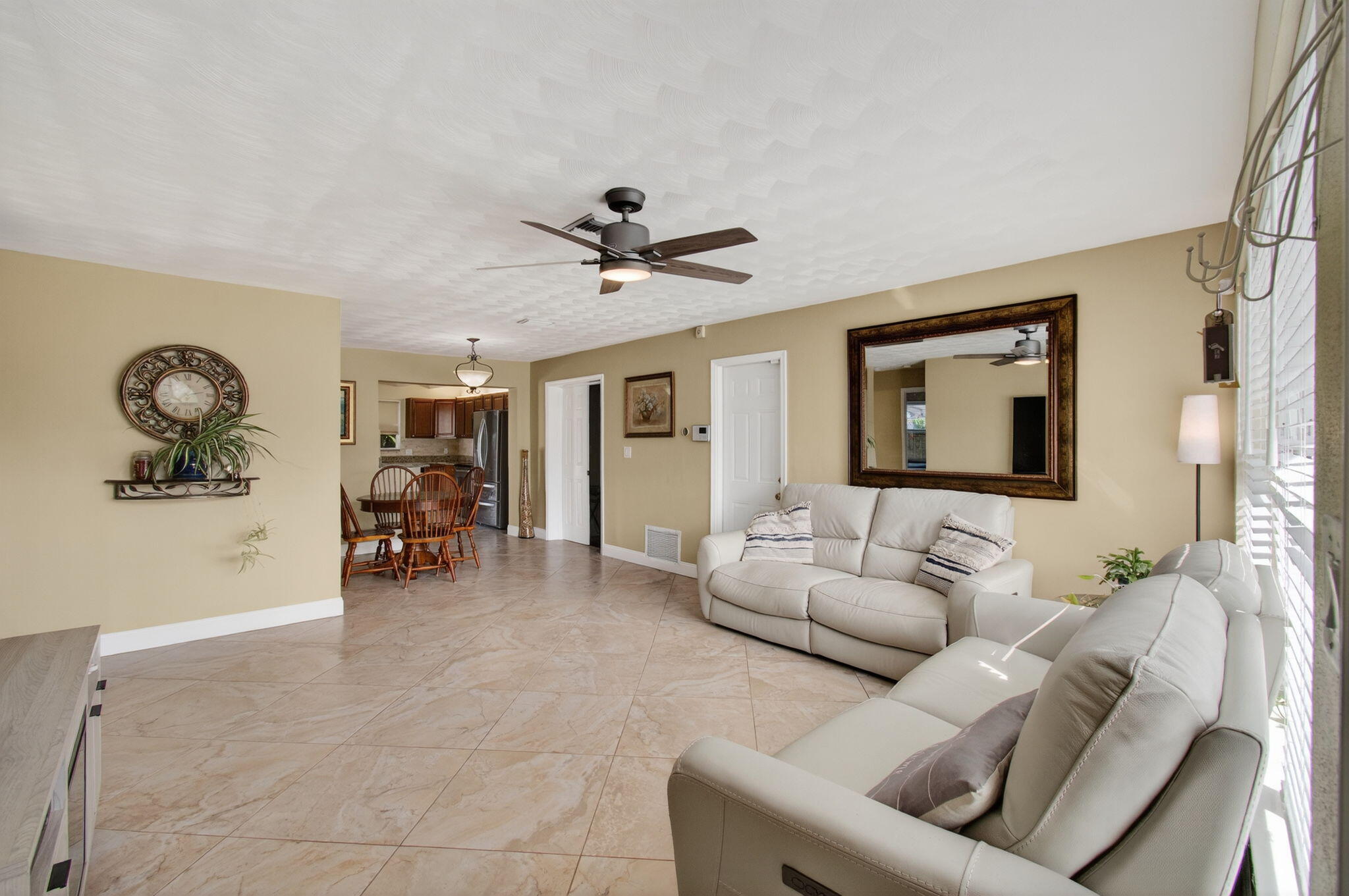2841 Northeast 8th Terrace Pompano Beach, FL 33064 - Photo 19 of 65 a living room with furniture and a large window