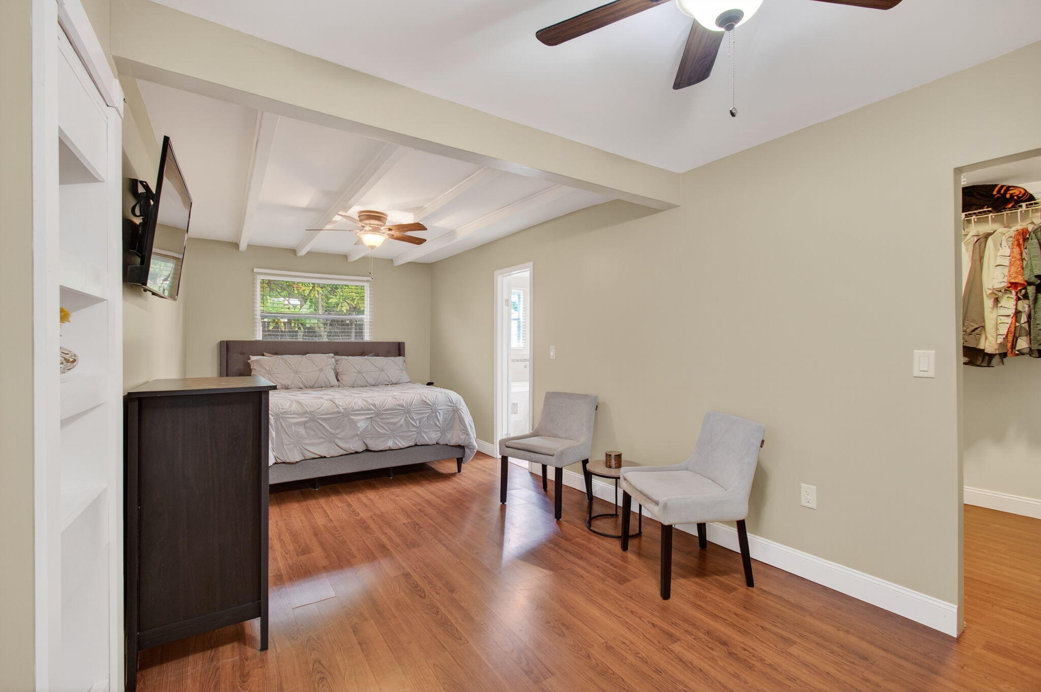 2841 Northeast 8th Terrace Pompano Beach, FL 33064 - Photo 30 of 65 a bedroom with furniture and a wooden floor