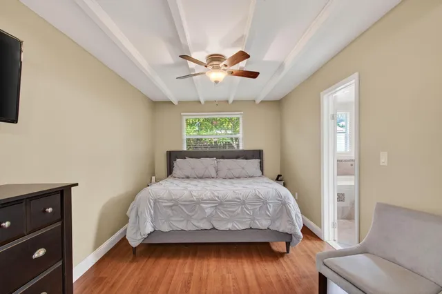 a bathroom with a granite countertop toilet sink and shower
