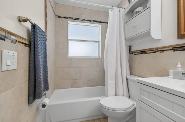 a view of a patio with table and chairs and potted plants