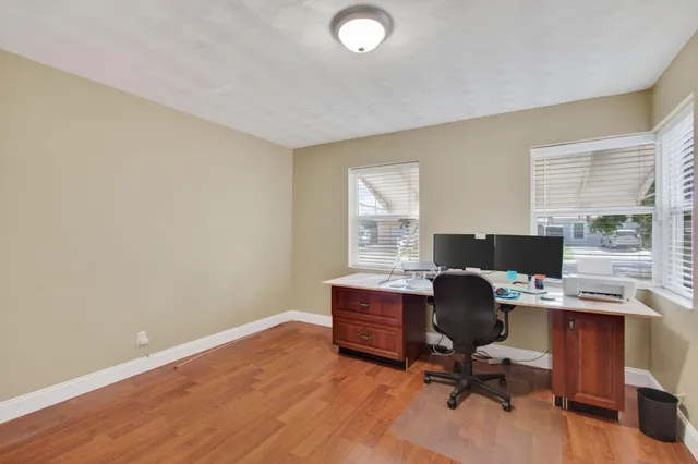 a view of an house with backyard space and garden