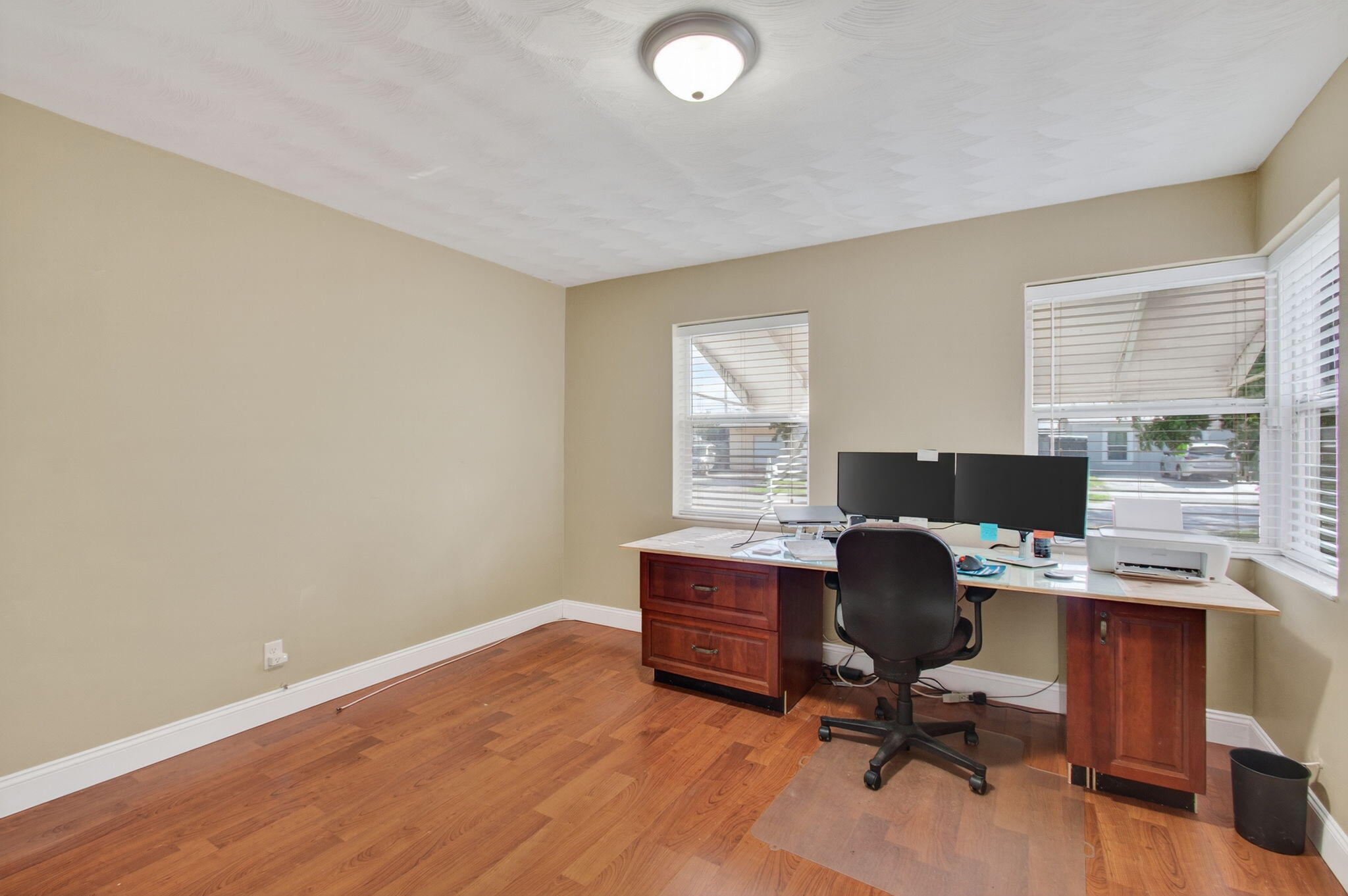 2841 Northeast 8th Terrace Pompano Beach, FL 33064 - Photo 43 of 65 a view of a workspace with furniture and a window