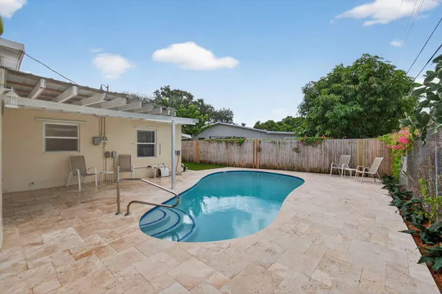 an aerial view of multiple houses with yard