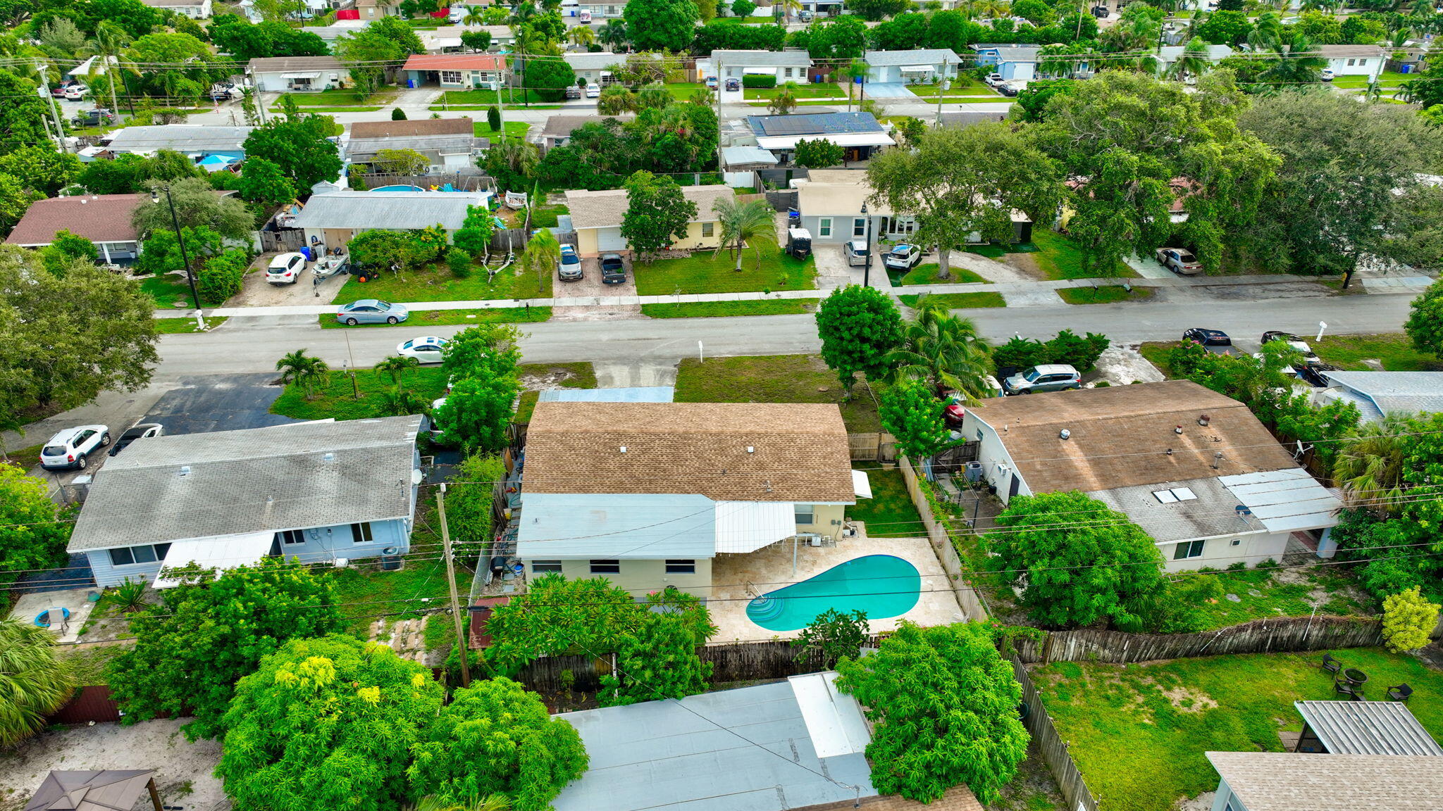2841 Northeast 8th Terrace Pompano Beach, FL 33064 - Photo 65 of 65 an aerial view of multiple houses with yard