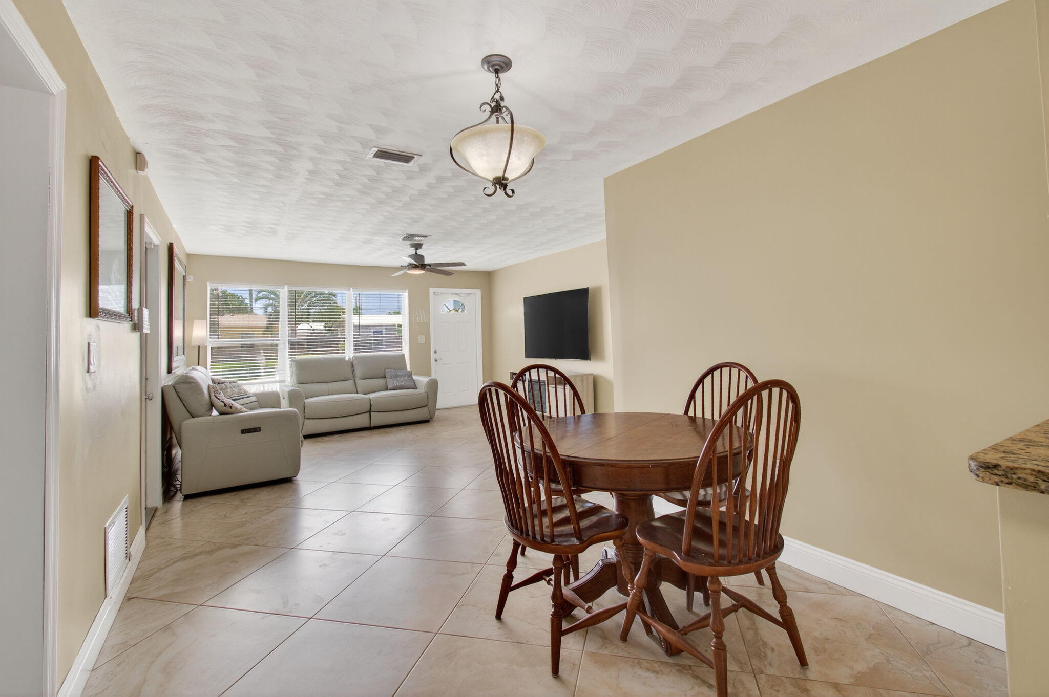 2841 Northeast 8th Terrace Pompano Beach, FL 33064 - Photo 8 of 65 a dining room with furniture and window