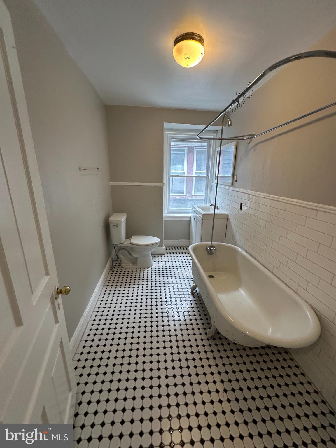 4710 Warrington Avenue, Unit 3 Philadelphia, PA 19143 - Photo 20 of 32 a bathroom with a sink a toilet and shower