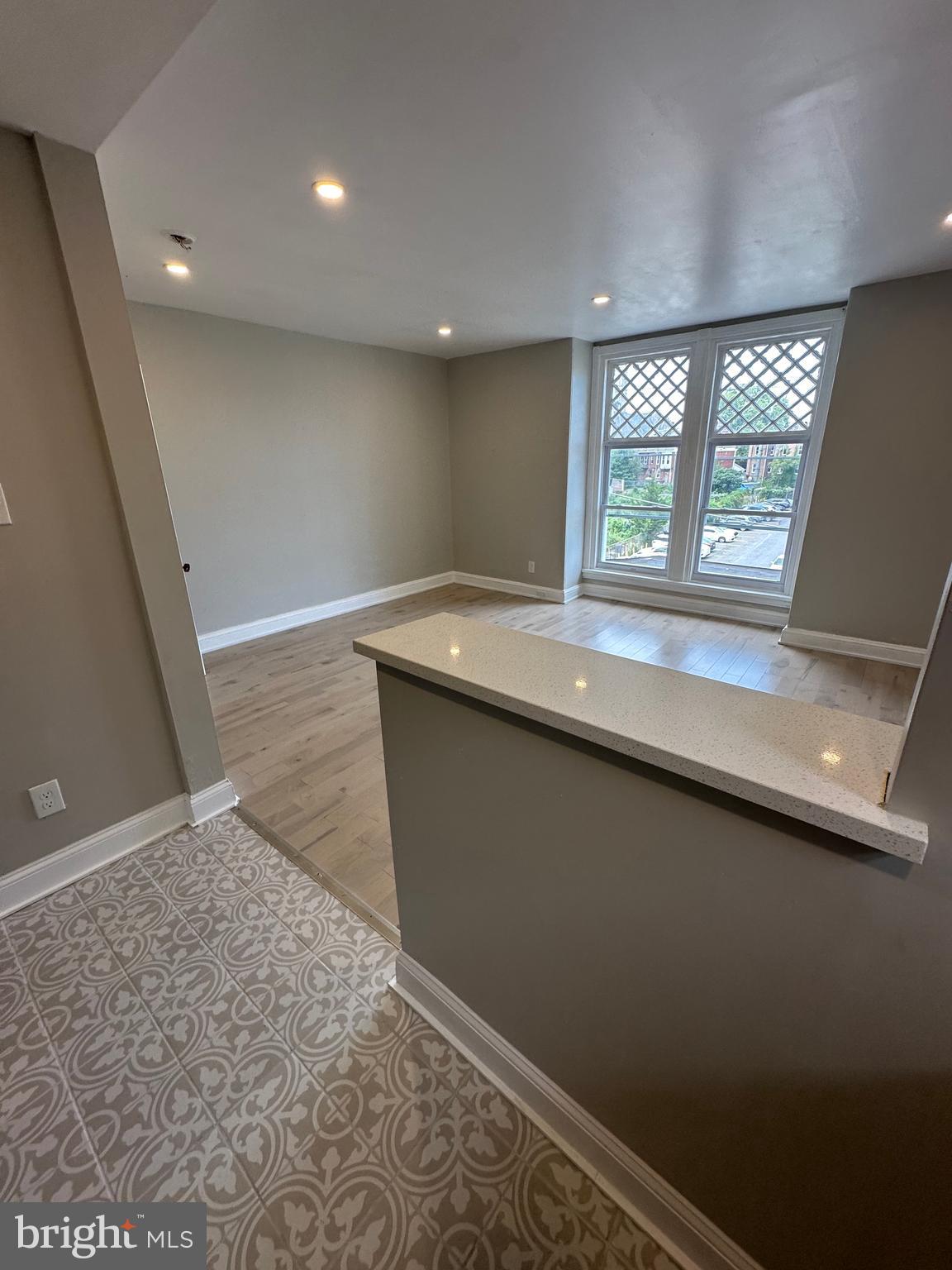 4710 Warrington Avenue, Unit 3 Philadelphia, PA 19143 - Photo 27 of 32 an empty room with windows