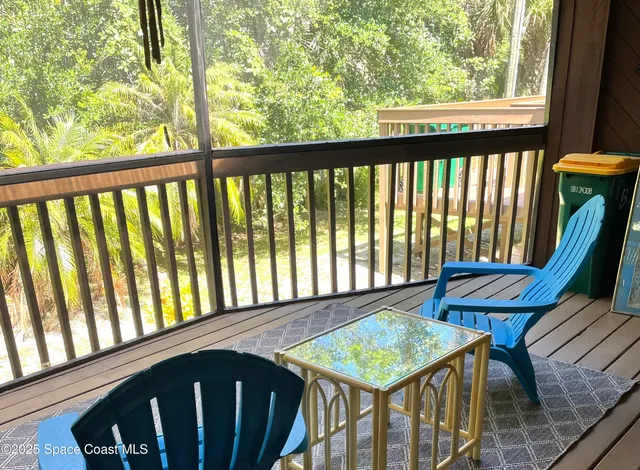 a view of a balcony with furniture