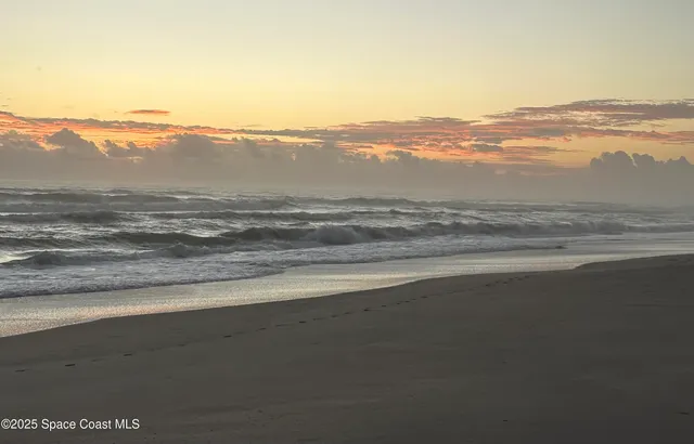 a view of an ocean and mountain