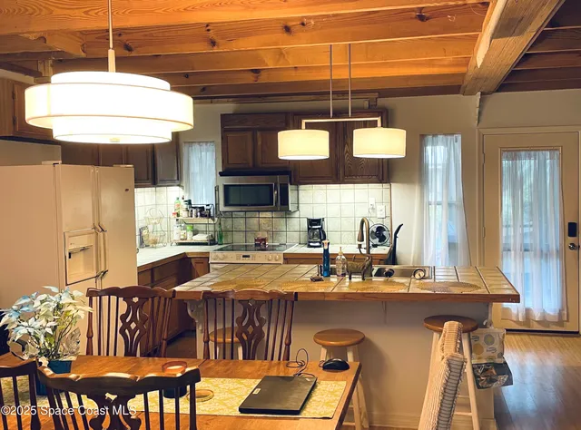 a kitchen with a table and chairs in it