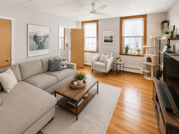 a living room with furniture or couch and a flat screen tv