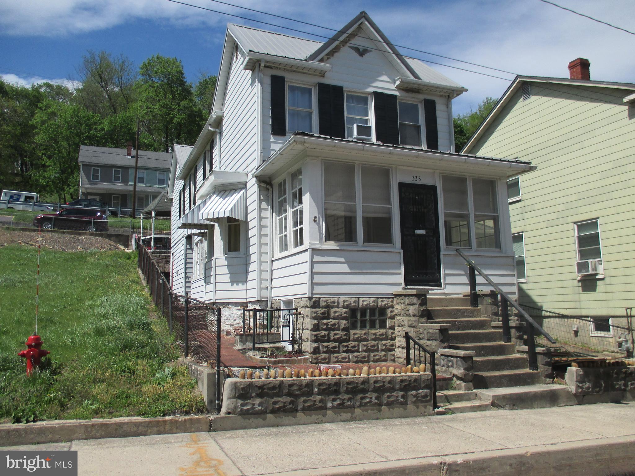 333 Pratt Street Luke, MD 21540 - Photo 1 of 42 a front view of a house with garden