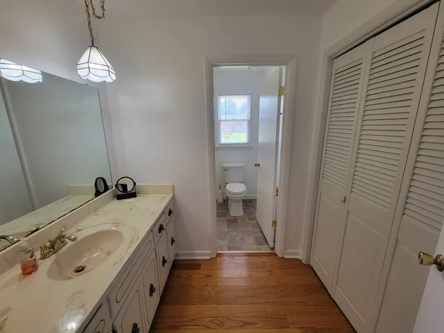 a bathroom with a double vanity sink and a mirror