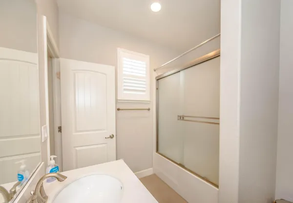 a bathroom with a sink and a shower