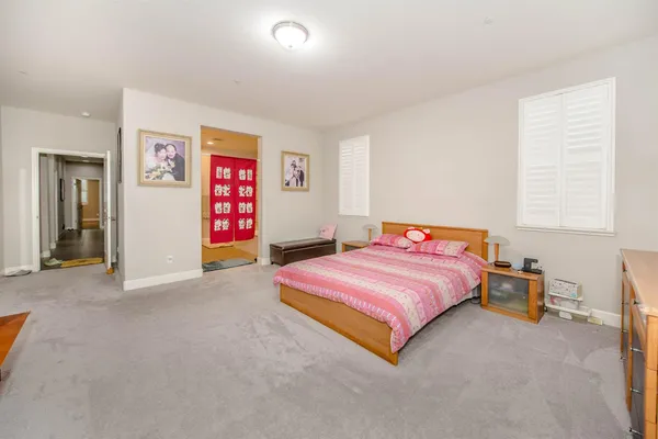 a bedroom with a bed and a couch