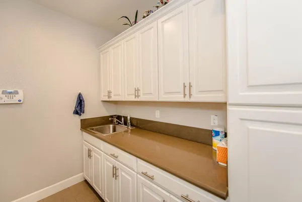 a kitchen with a sink and cabinets