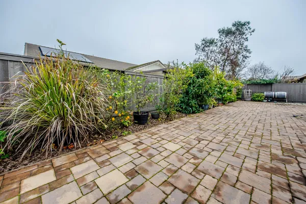 a view of a backyard of the house