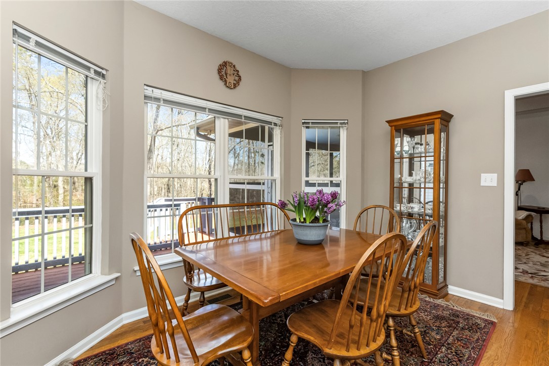 108 Pearman Drive Pendleton, SC 29670 - Photo 12 of 50 This bright dining area features abundant natural light and rich wood flooring.