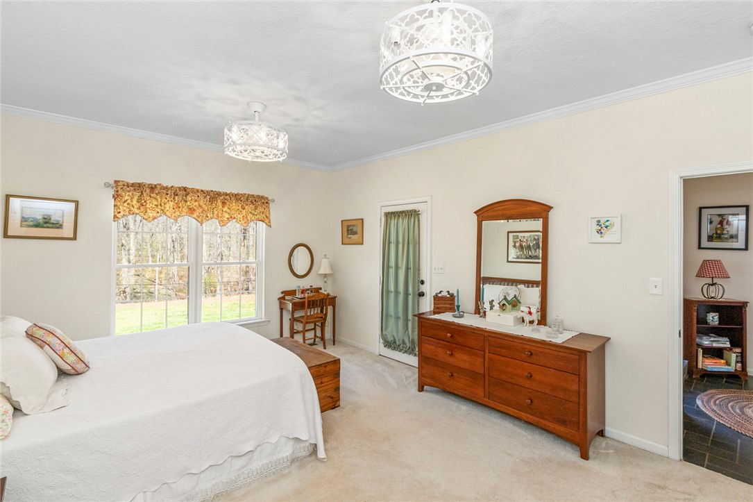 108 Pearman Drive Pendleton, SC 29670 - Photo 28 of 50 This spacious bedroom offers ample light and a comfortable, inviting atmosphere.